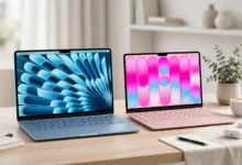 MacBook Air M5 in Sky Blue next to MacBook Neo in Blush on a desk